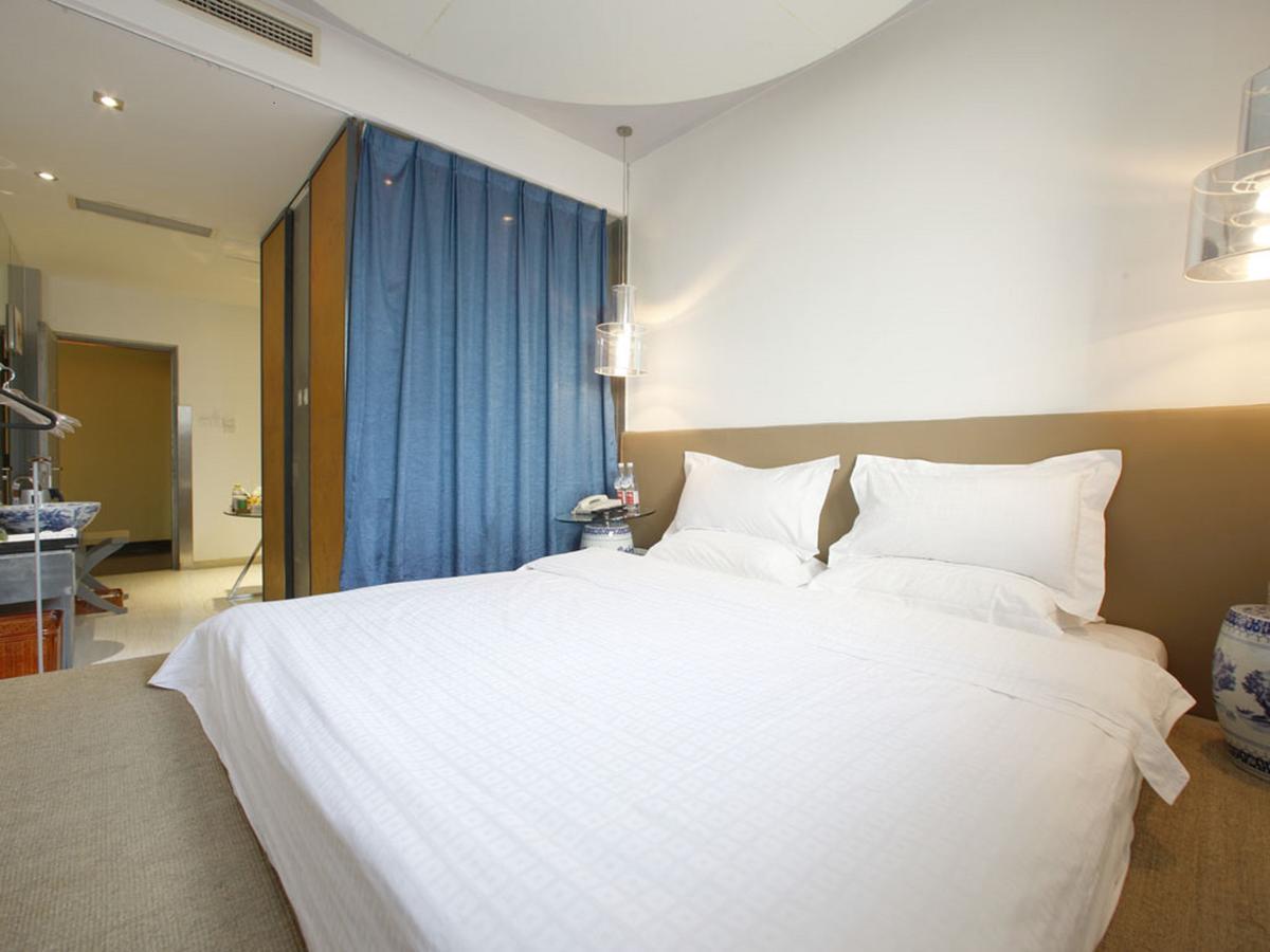 China Community Art Habitat Hotel Циндао Номер фото