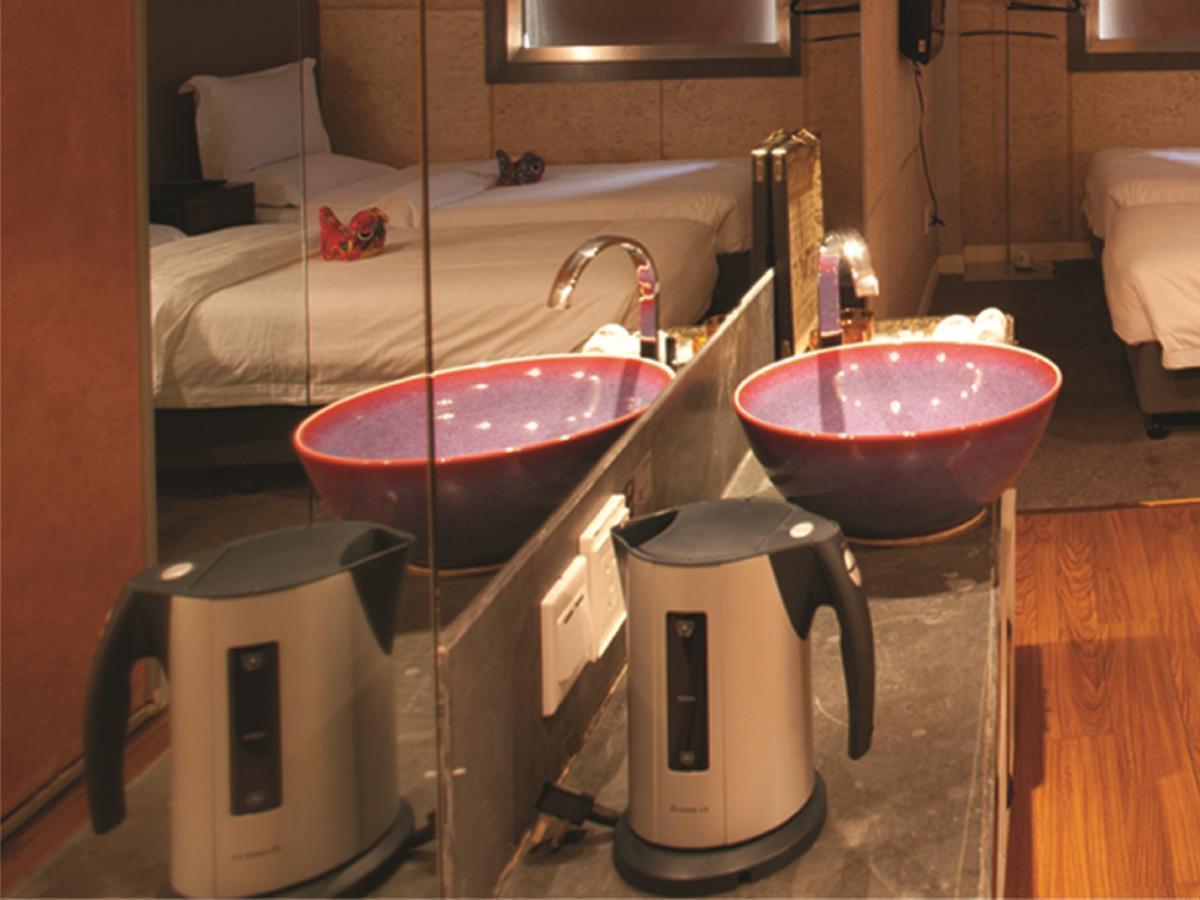 China Community Art Habitat Hotel Циндао Номер фото
